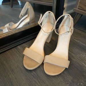 Tan open toed pumps